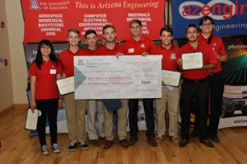 Team 16082 University students with a large award check