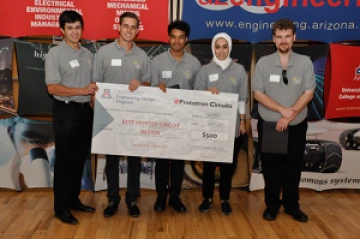 Team 16080 University students with a large award check